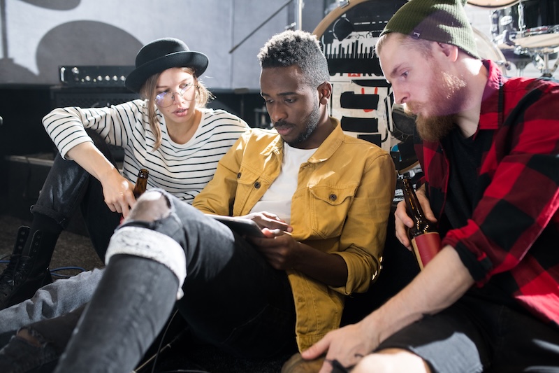 musicians looking at a set list